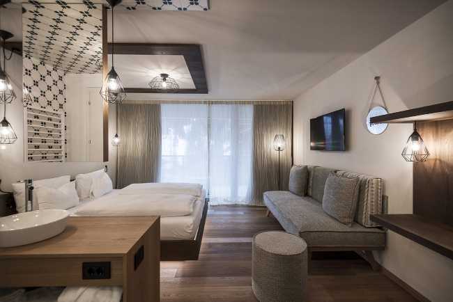 bedroom with sofa and lights